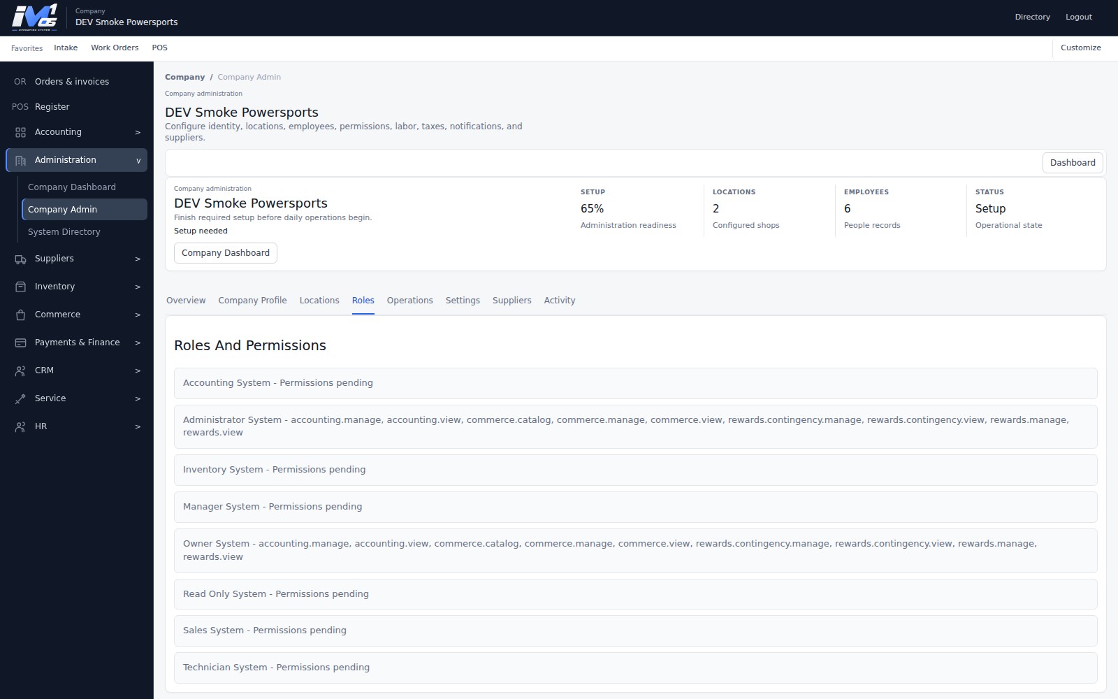 Actual iM1 OS Company Roles and Permissions workspace showing Company-scoped roles and assigned module permissions